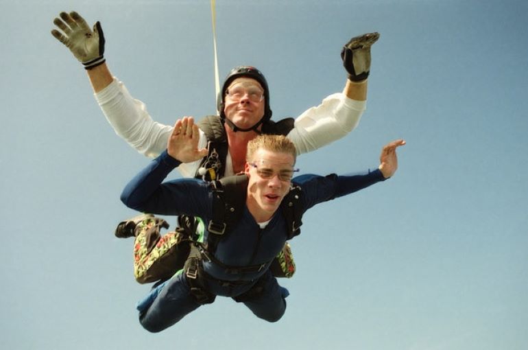 Two skydivers in the air. Sky Diver New England is the perfect option for weekend activities near Boston for adventure-seekers.